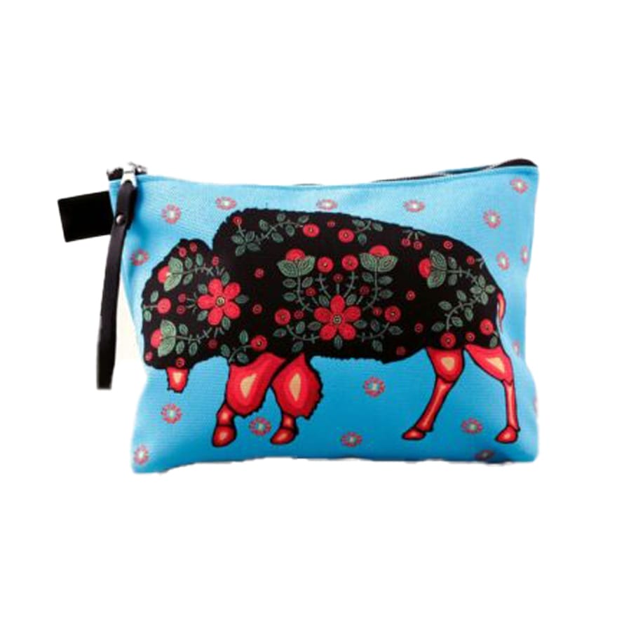 The Multi-purpose Bag - Métis Buffalo Spirit is a small blue pouch showcasing a colorful illustration of a bison, adorned with vibrant red flowers and green leaves, featuring a black zipper at the top.