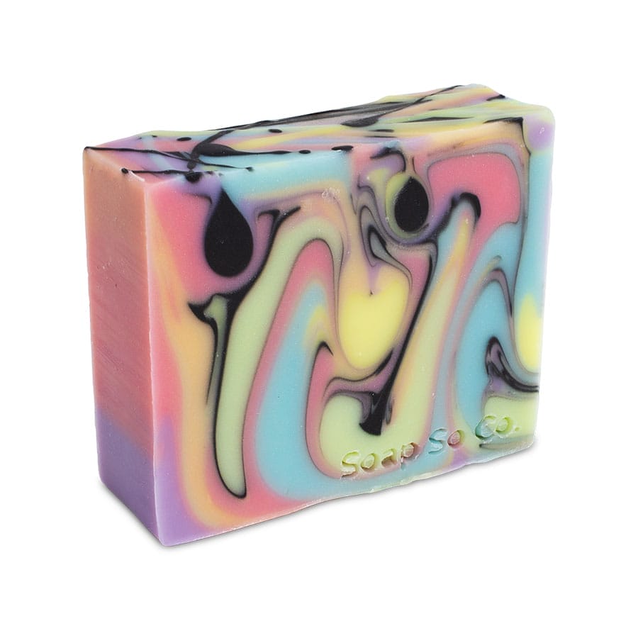 A rectangular bar of Soap So Co. featuring colorful, swirled patterns in shades of pink, blue, yellow, and black, with the brand name engraved on the side.