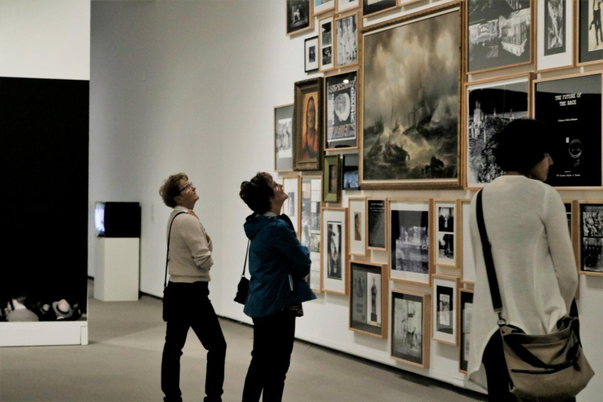 Image of two patrons standing in the previous exhibition