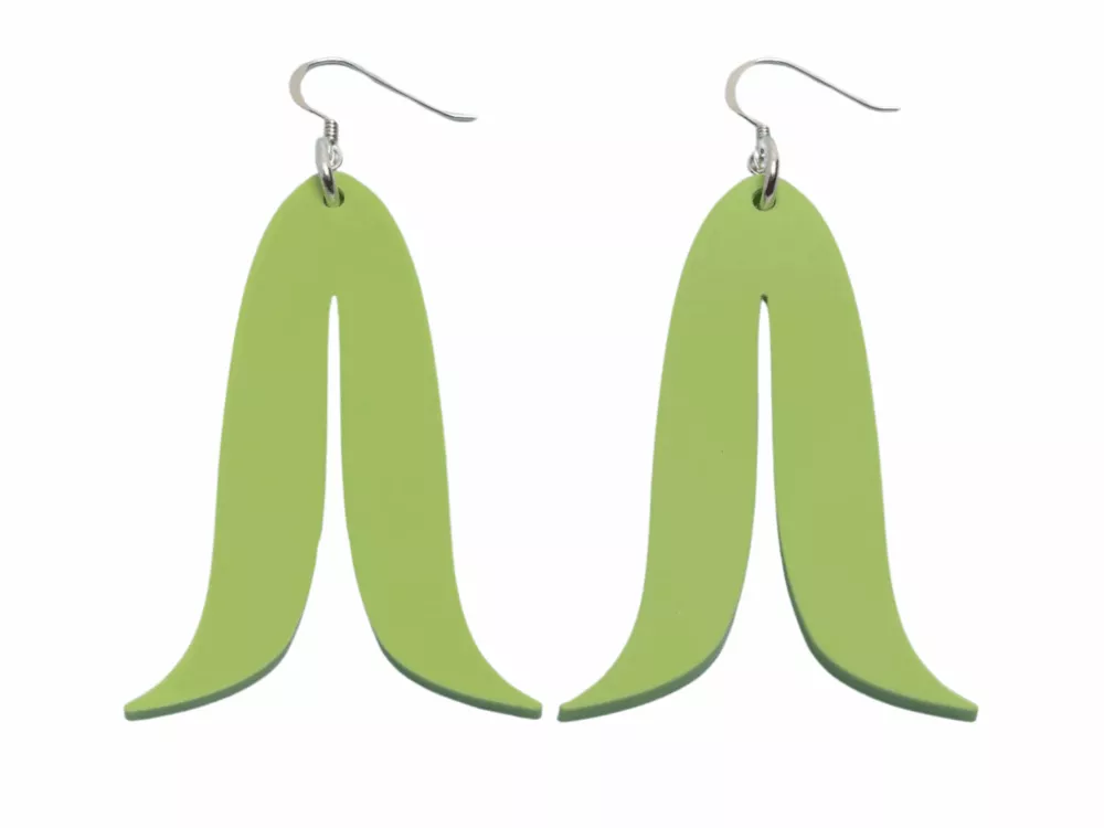 Warren Steven Scott earrings in a green hue, featuring an elongated banana peel design with hooks for wearing.