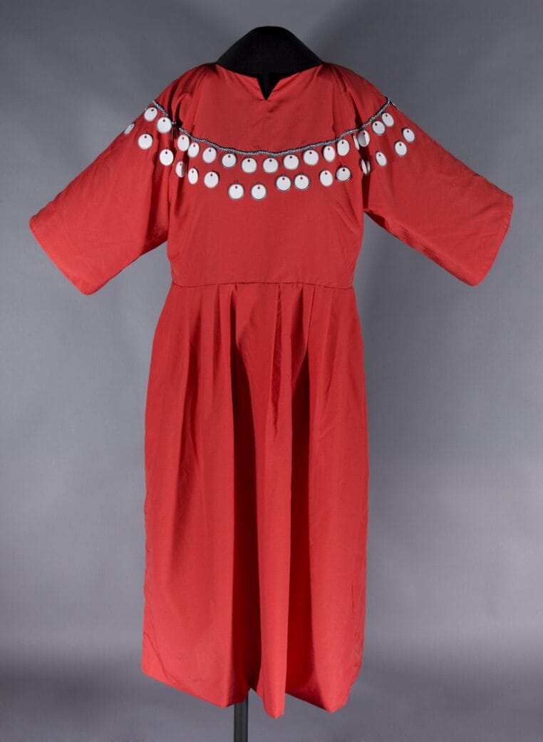 Faye Heavyshield, Red dress, 2008 nylon, cotton, metal and paper tags, glass beads. Collection of the Alberta Foundation for the Arts.
