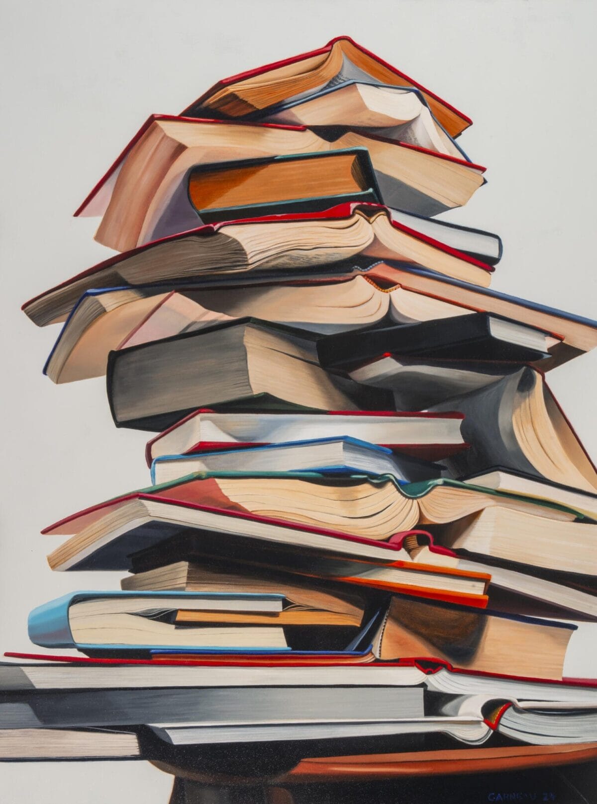 A tall stack of various open and closed books is precariously balanced, creating a colorful and detailed tower against a plain background. Among the volumes, a MacKenzie Gala catalog stands out, its pages slightly fanned open next to a SENSORIA guide, adding a touch of eclectic charm.