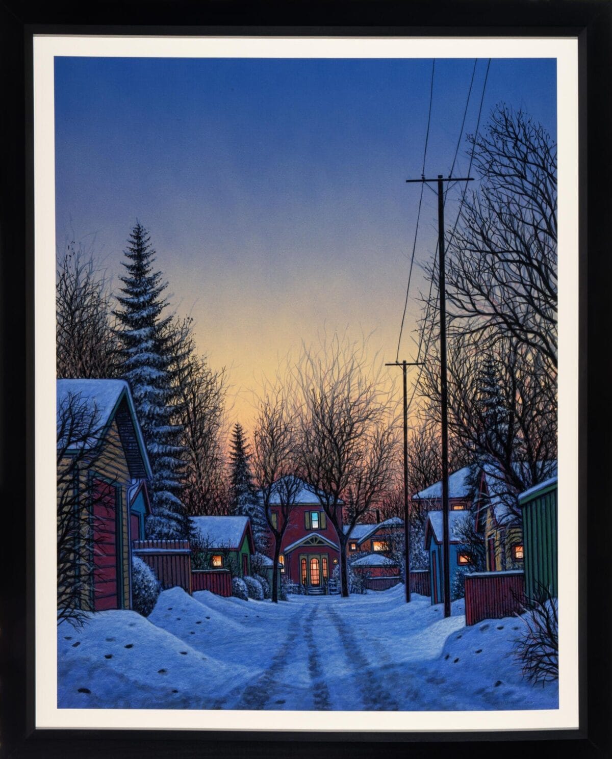 A serene winter scene depicts a snow-covered alley lined with houses on both sides, illuminated by the warm glow of evening lights from the windows. Bare trees and a few evergreens frame the scene, with a golden MacKenzie Gala sunset coloring the sky, while power lines are visible overhead.