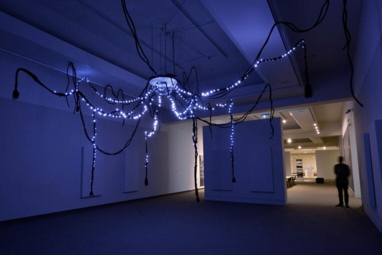 Kite and Devin Ronneberg, Ínyan Iyé (Telling Rock), installation view, 2019. Translation by Alex Firethunder. Song, power, sound, processors, machine learning decisions, handmade circuitry, gold, silver, copper, aluminum, silicon, fiberglass. Photo by Don Hall.