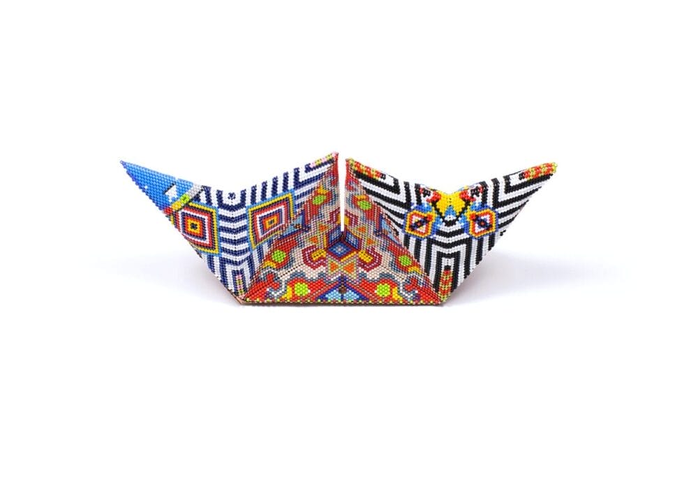 Geometric shape, vibrantly beaded in front of a white background titled 