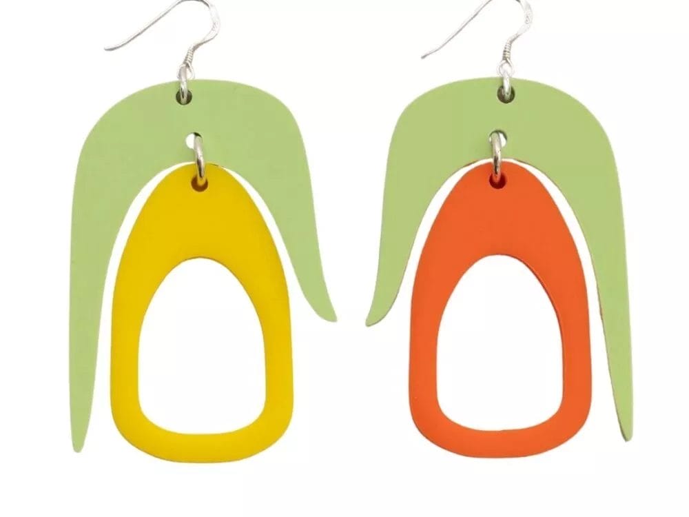 Introducing the Warren Steven Scott Earrings: a bold and contemporary pair featuring modern abstract shapes. Each earring showcases a vibrant green teardrop-shaped form layered with striking yellow and orange ovals, complemented by silver hooks for effortless wearing.