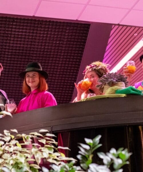 Gala guests looking down from balcony