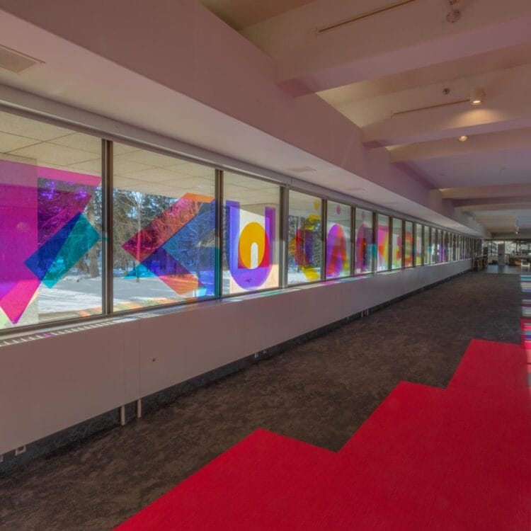 Window Installation by artist Joi T. Arcand in MacKenzie Lobby made of dichroic film
