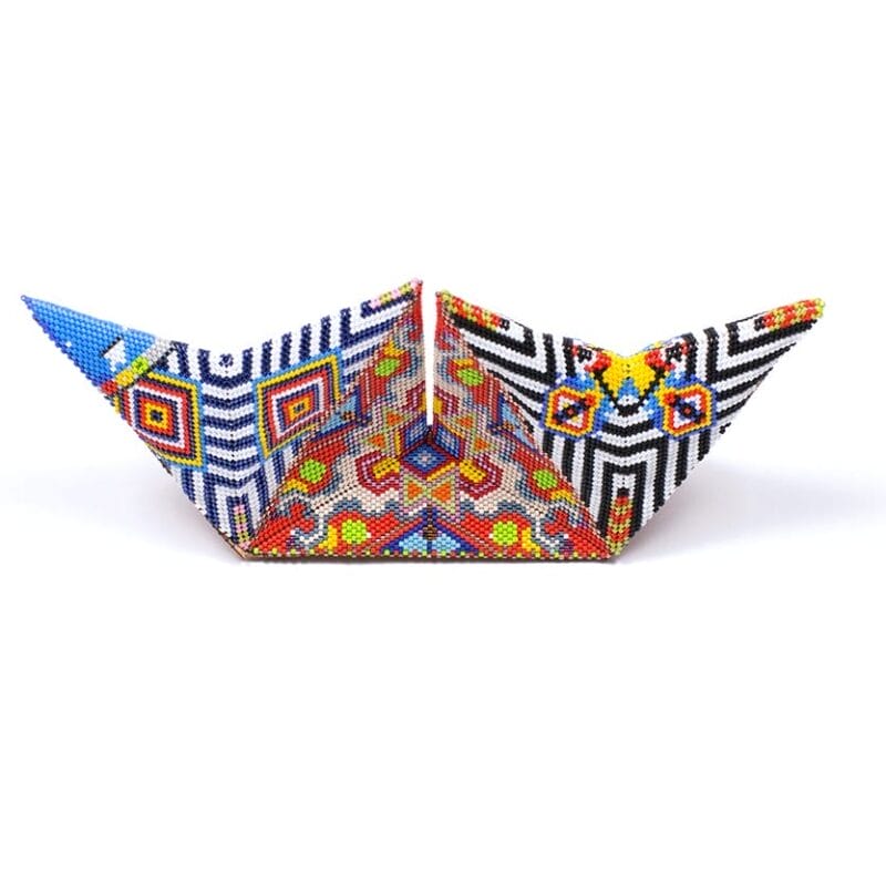 Geometric shape, vibrantly beaded in front of a white background.