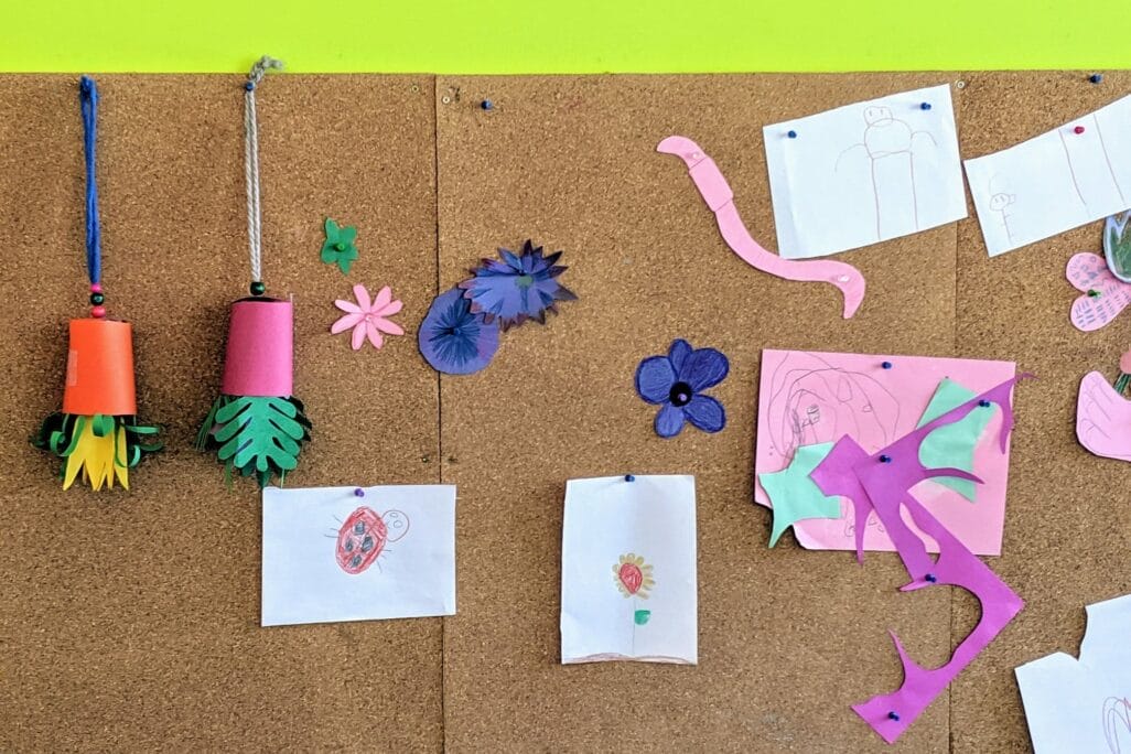 Craft works hanging from corkboard in BMO Learning Centre