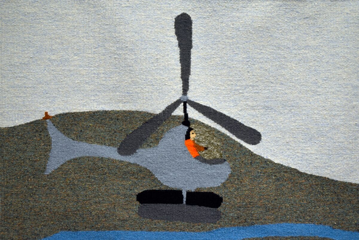 A whimsical, childlike drawing uses visual storytelling to depict a grey helicopter soaring over a hill and blue river, with a person in orange inside. On the hill in the background rests a small orange object, adding charm to the scene.