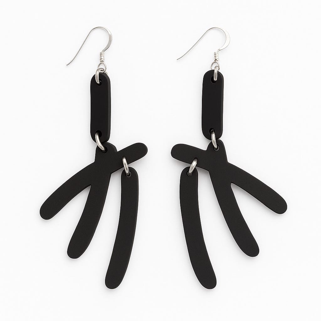 The Warren Steven Scott Earrings are black, minimalist dangle earrings with three curved segments hanging from a rectangular top, attached to silver hooks. Their modern abstract design is shown on a white background.