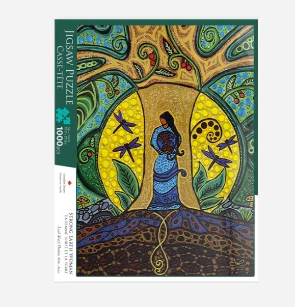 The Leah Dorion Strong Earth Women Puzzle is a 1000-piece jigsaw featuring a woman in a blue dress under a vibrant, patterned tree with dragonflies, all set among abstract nature-inspired designs.
