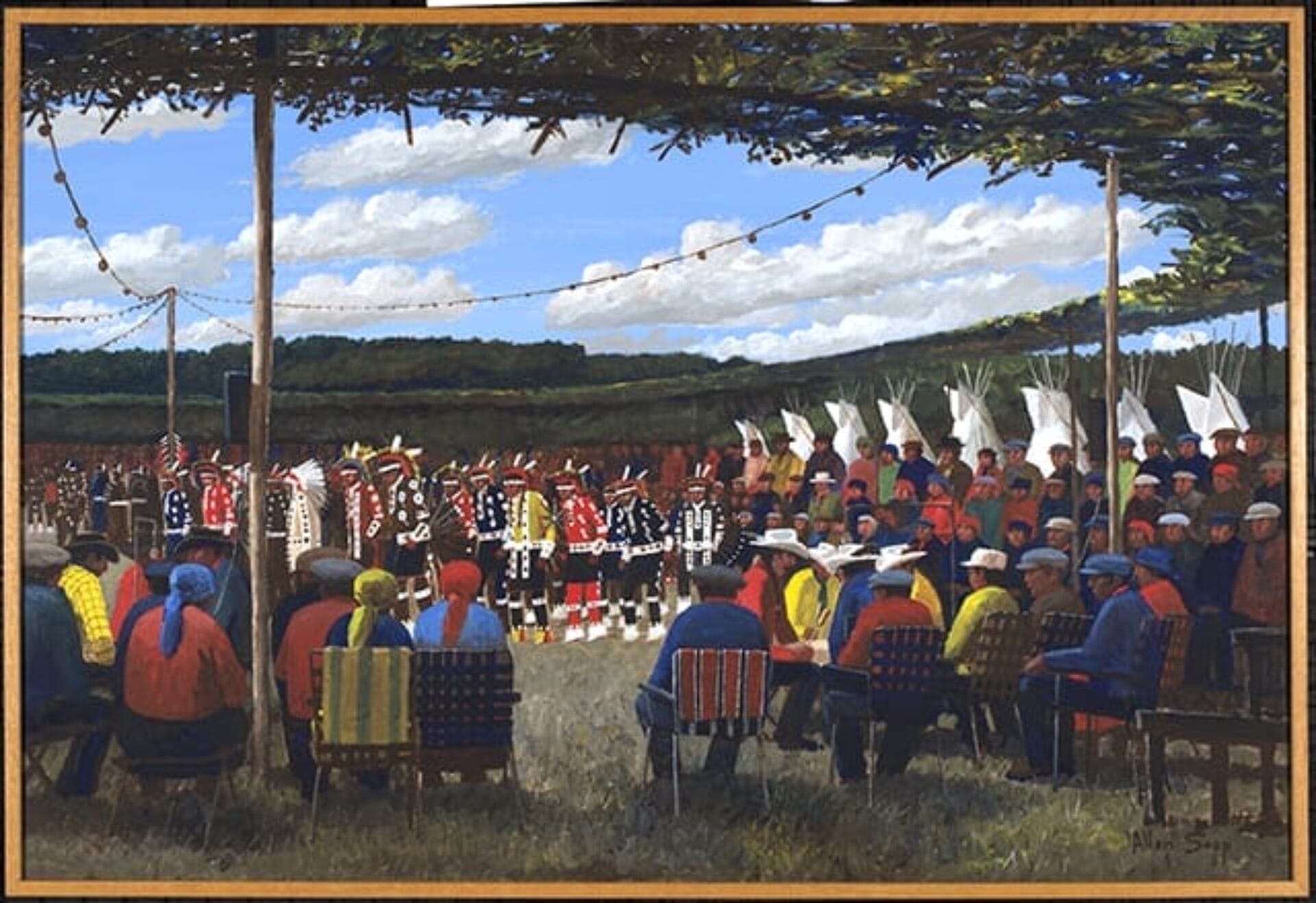 A painting depicts a cultural gathering outdoors under a large canopy. People dressed in vibrant traditional attire dance while others sit in a semicircle observing, forming the building blocks of community. The background features a lush, green landscape under a partly cloudy sky.