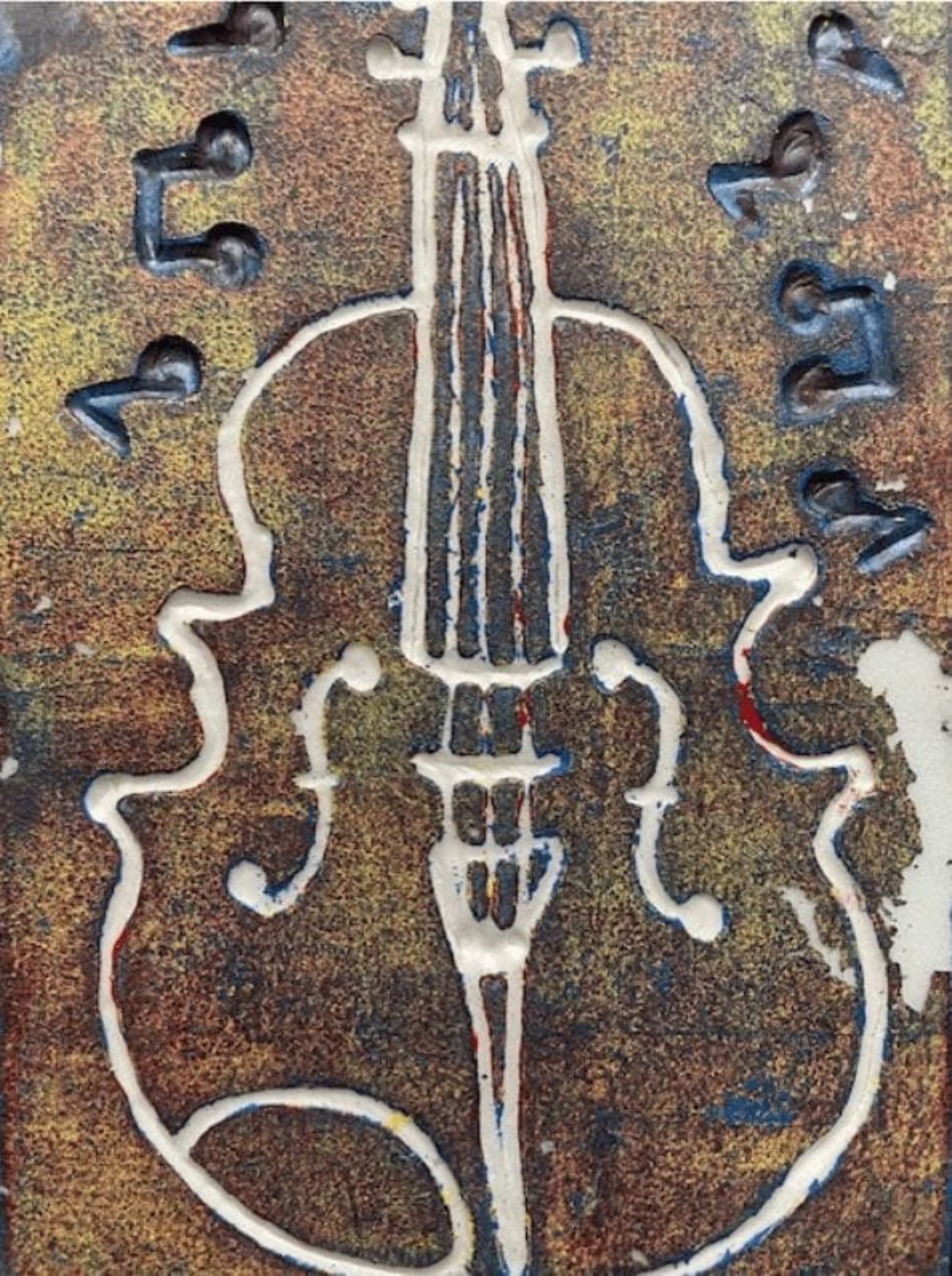 An art piece of a violin created by using a printmaking method called relief printing.