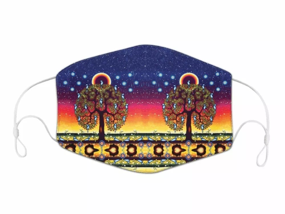 A Mask with James Jacko Artwork featuring two stylized trees with intricate, colorful patterns. The background transitions from a starry night sky at the top to a sunset gradient of blue, pink, and yellow with a decorative border at the bottom.