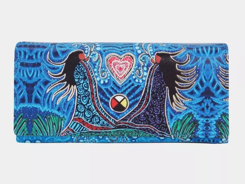 A colorful Wallet with Leah Dorian Artwork featuring an intricate design. The art depicts two stylized black-haired figures facing each other, holding hands with their arms forming a heart shape. The background is predominantly blue with vibrant, swirling patterns.